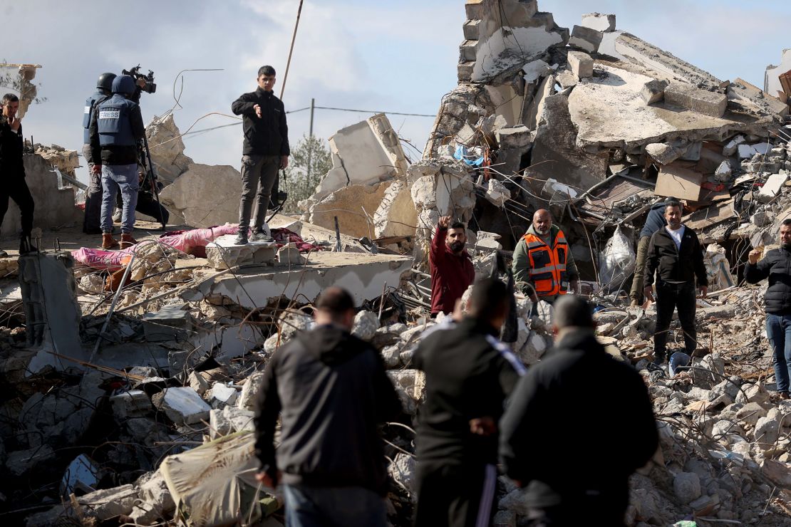 Palestinians inspect the rubble of the destroyed house on January 23 in Jenin.