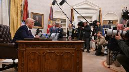 President Donald Trump speaks to the press in the Oval Office on Thursday.