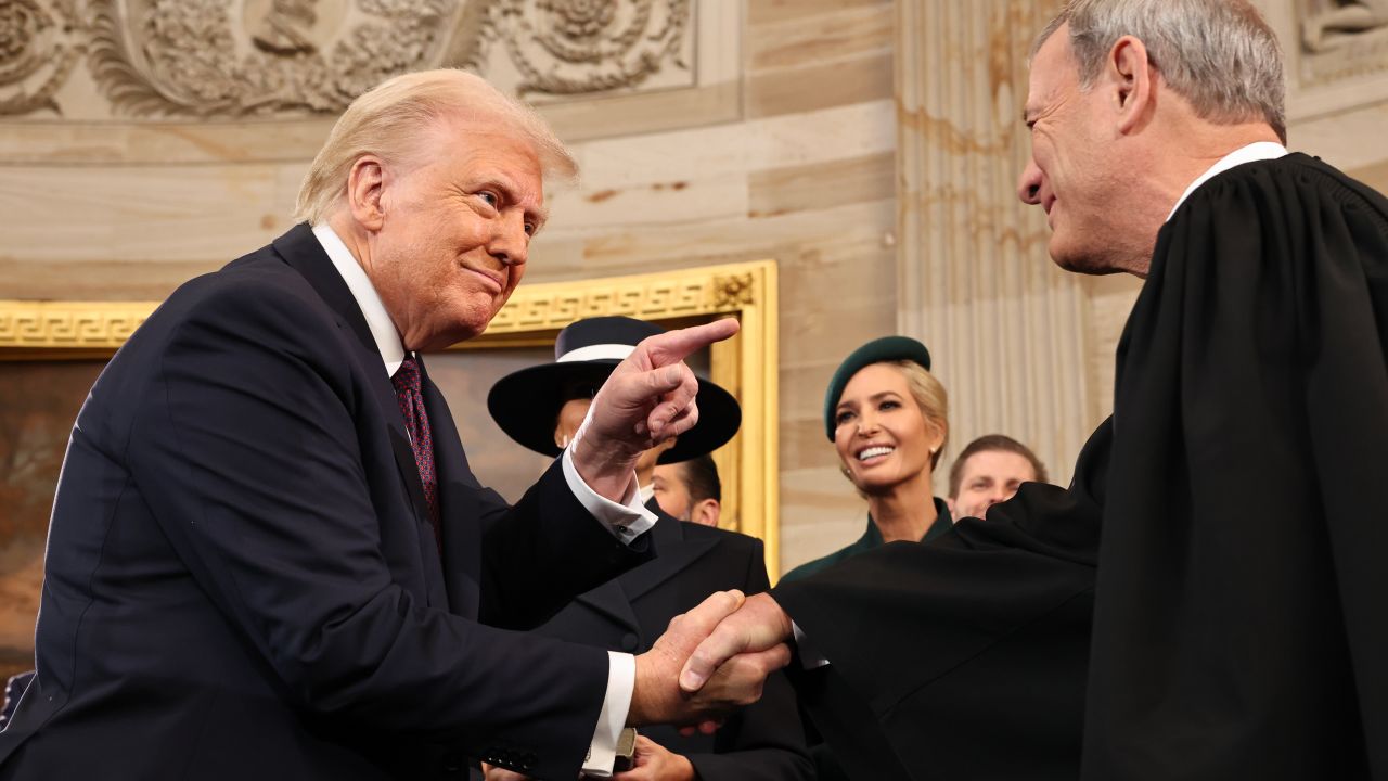 President Donald Trump gestures to Chief Justice John Roberts after he was sworn in during inauguration ceremonies in the Rotunda of the U.S. Capitol on January 20, 2025 in Washington, DC.
