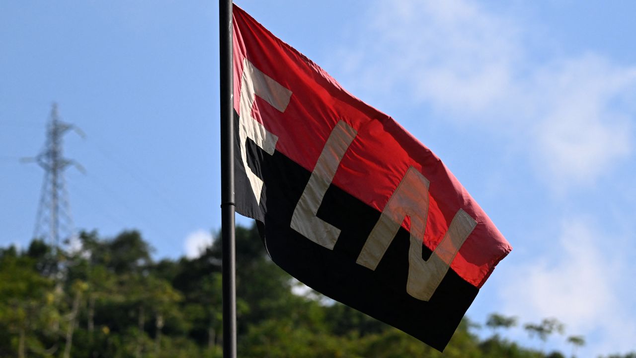 A flag of the National Liberation Army (ELN) guerrilla group flutters in the wind in Teorama municipality, Catatumbo region, Norte de Santander department, Colombia, on January 23, 2025. Colombia is battling its worst security crisis in a decade after a series of guerrilla attacks in the north of the country have left at least 80 people dead and displaced 36,000 others. (Photo by Raul ARBOLEDA / AFP) (Photo by RAUL ARBOLEDA/AFP via Getty Images)