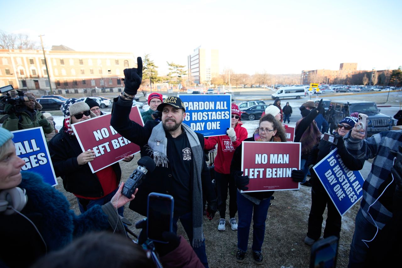 On Monday, Joshua Macias, center, gathers with other demonstrators outside the DC Central Detention Facility in Washington, DC.