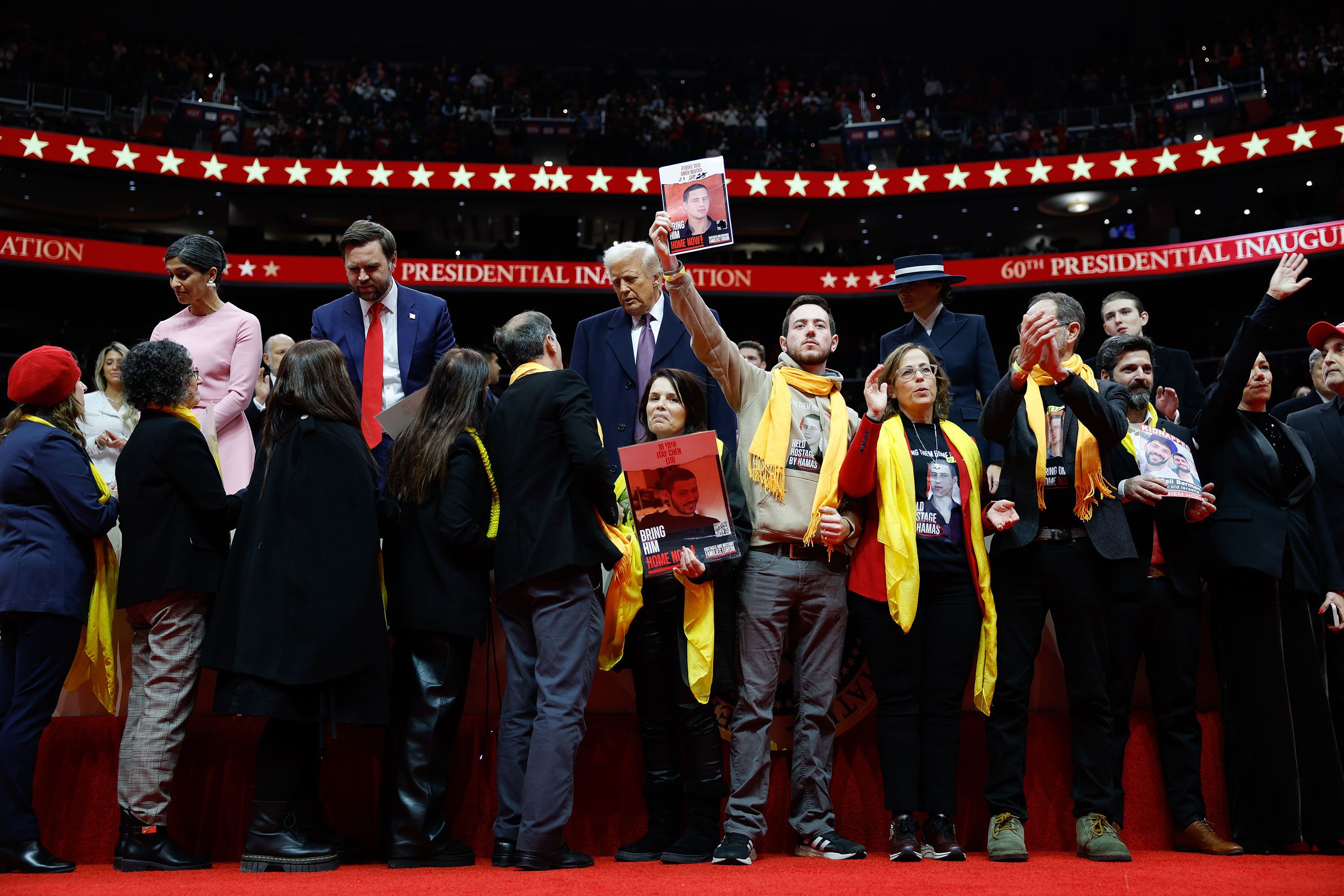 <a href="https://www.cnn.com/politics/live-news/trump-inauguration-01-2025#cm65md4z800083b71k6vwfxum">Families of hostages</a> held in Gaza are brought on stage in Capital One Arena on Monday. Trump reiterated his promise to bring the hostages home.