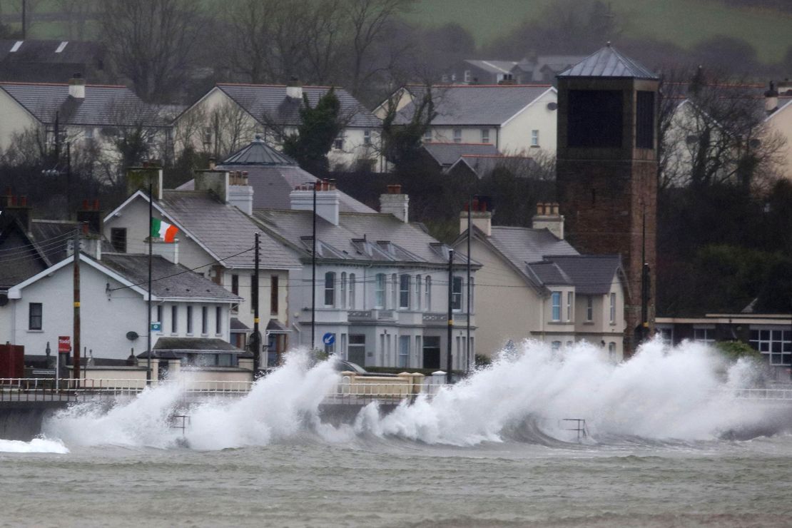 Waves break against the sea wall in Carnlough on the north east coast of Northern Ireland early Friday morning.