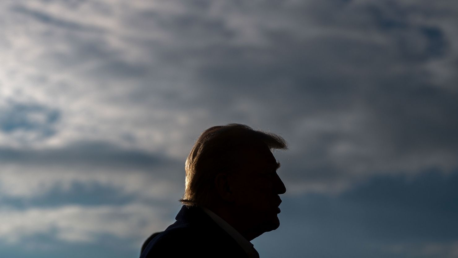 President Donald Trump speaks to members of the press as he and first lady Melania Trump prepare to depart the White House aboard Marine One on January 24, 2025.