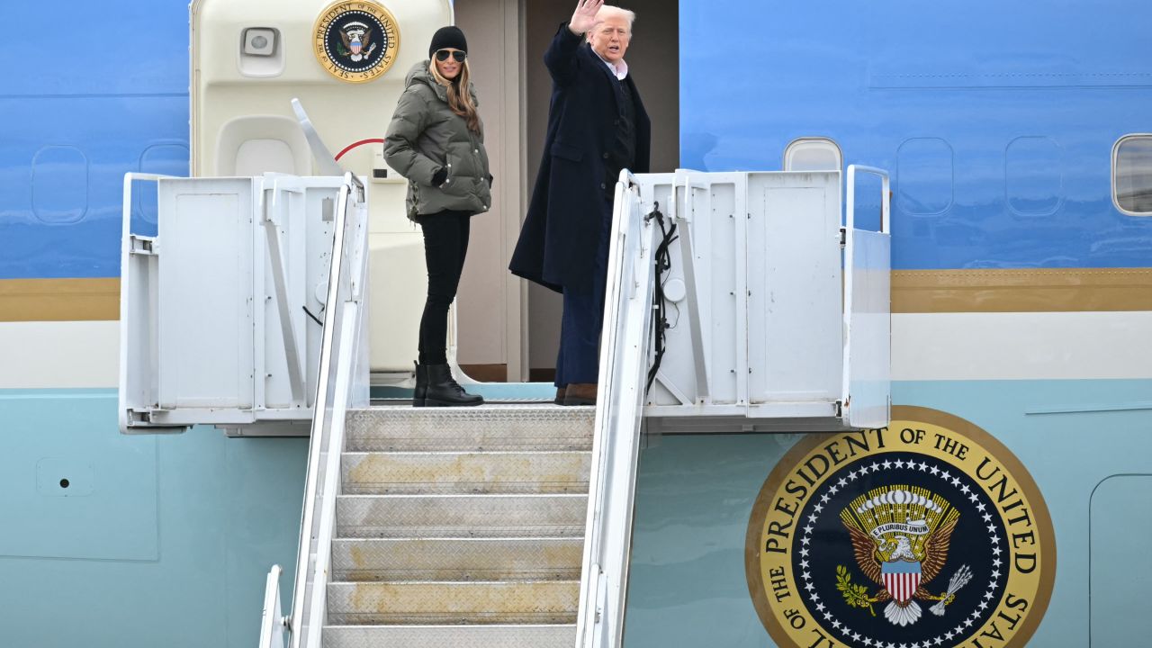 US President Donald Trump and First Lady Melania Trump board Air Force One at Asheville Regional Airport in Fletcher, North Carolina, on January 24, 2025, after visiting the region devastated by Hurricane Helene. Trump is headed to California to tour damage caused by the Los Angeles fires. (Photo by Mandel NGAN / AFP) (Photo by MANDEL NGAN/AFP via Getty Images)