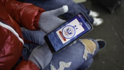 NOGALES, MEXICO - JANUARY 21: A immigrant from Venezuela tries in vain to access the CBP One app day a day after the second inauguration of U.S. President Donald Trump on January 21, 2025 in Nogales, Mexico. The incoming administration shut down the app which was created by the Biden administration to allow migrants to schedule appointments to gain entry into the United States. Trump signed executive orders on his first day in office declaring a state of emergency at the U.S. southern border, halting asylum claims and launching a campaign of mass deportations. The Venezuelan woman said she had been waiting with her family in Mexico City for 11 months for an appointment with U.S. immigration officials which they had scheduled with the app. (Photo by John Moore/Getty Images)