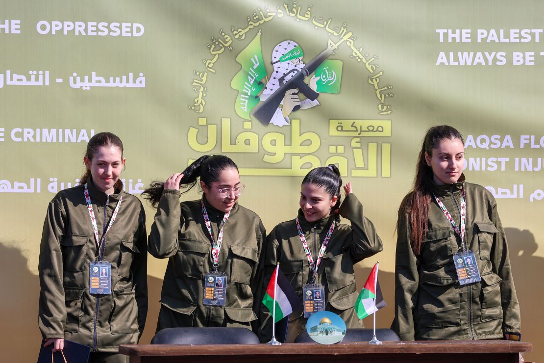 From left, Naama Levy, Liri Albag, Daniella Gilboa and Karina Ariev stand on a stage in Gaza City on January 25 before being handed to Red Cross intermediaries in the hostage deal between Hamas and Israel.