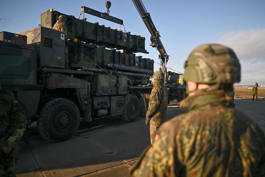 German soldiers unload a US-made MIM-104 Patriot surface-to-air missile system in Jasionka, Poland, on January 23, 2025.