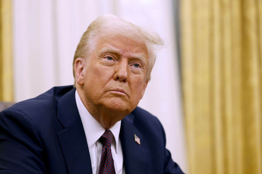 US President Donald Trump speaks to reporters after signing a series of executive orders in the Oval Office of the White House on January 23, 2025, in Washington, DC.