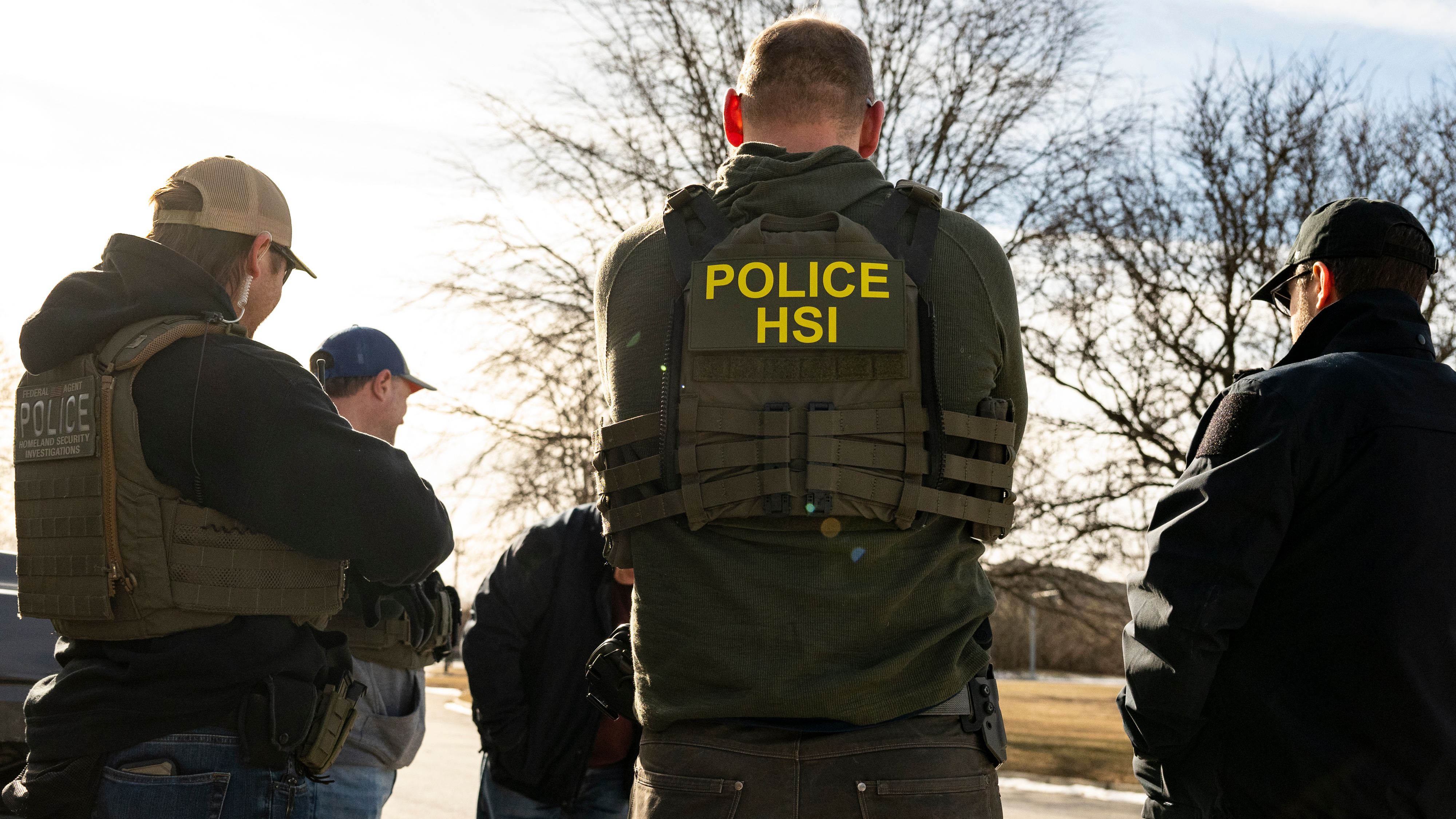 US Immigration and Customs Enforcement (ICE) agents prepare during a multi-agency targeted enforcement operation in Lyons, Illinois, US, on Sunday, Jan. 26, 2025. President Donald Trump has pledged to carry out the largest deportation effort in US history, vowing to ultimately deport all of the foreigners living in the country without permission. Photographer: Christopher Dilts/Bloomberg via Getty Images