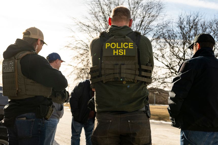 US Immigration and Customs Enforcement (ICE) agents prepare during a multi-agency targeted enforcement operation in Lyons, Illinois, US, on Sunday, Jan. 26, 2025.