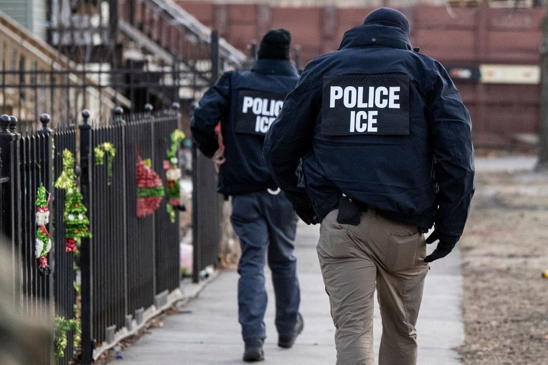 US Immigration and Customs Enforcement (ICE) agents walk down a street during a multi-agency targeted enforcement operation in Chicago, Illinois, US, on Sunday, Jan. 26, 2025. President Donald Trump has pledged to carry out the largest deportation effort in US history, vowing to ultimately deport all of the foreigners living in the country without permission.