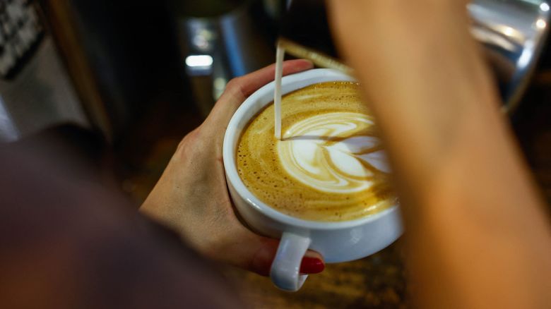 A worker prepares a coffee in New York.