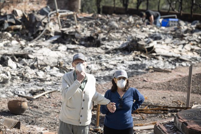 Pacific Palisades, CA - January 28: From left, Jim and Malihe Halff tour the remains of their fire-ravaged home in Pacific Palisades on Monday, January 27, 2025. (Photo by Drew A. Kelley/MediaNews Group/Long Beach Press-Telegram via Getty Images)