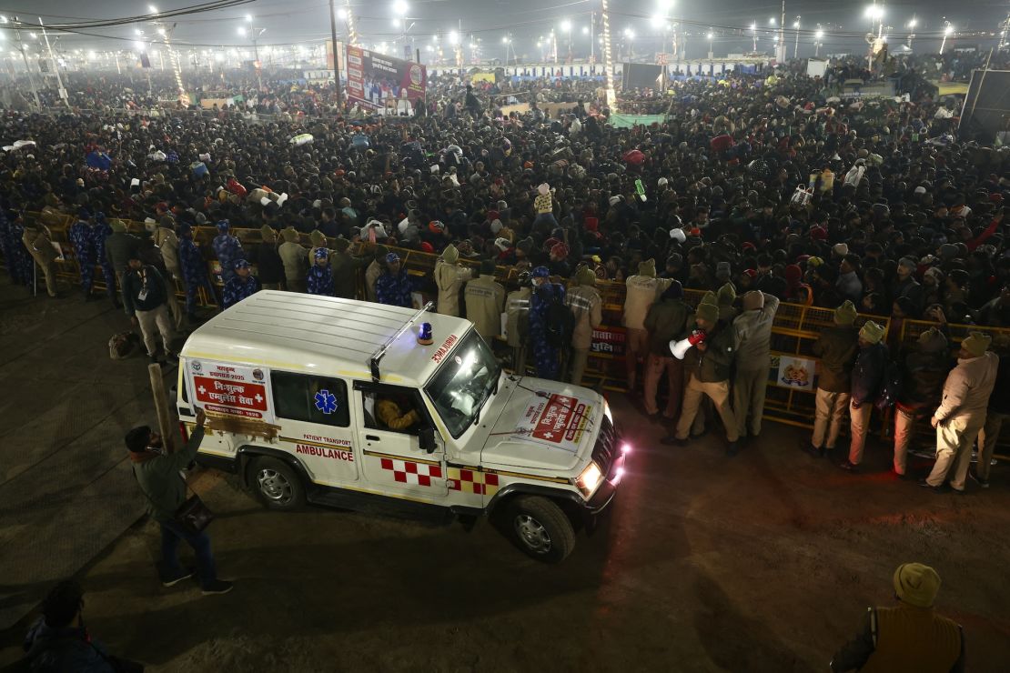 Police personnel gather around the crowd at the site of crowd crush in Prayagraj on January 29, 2025.