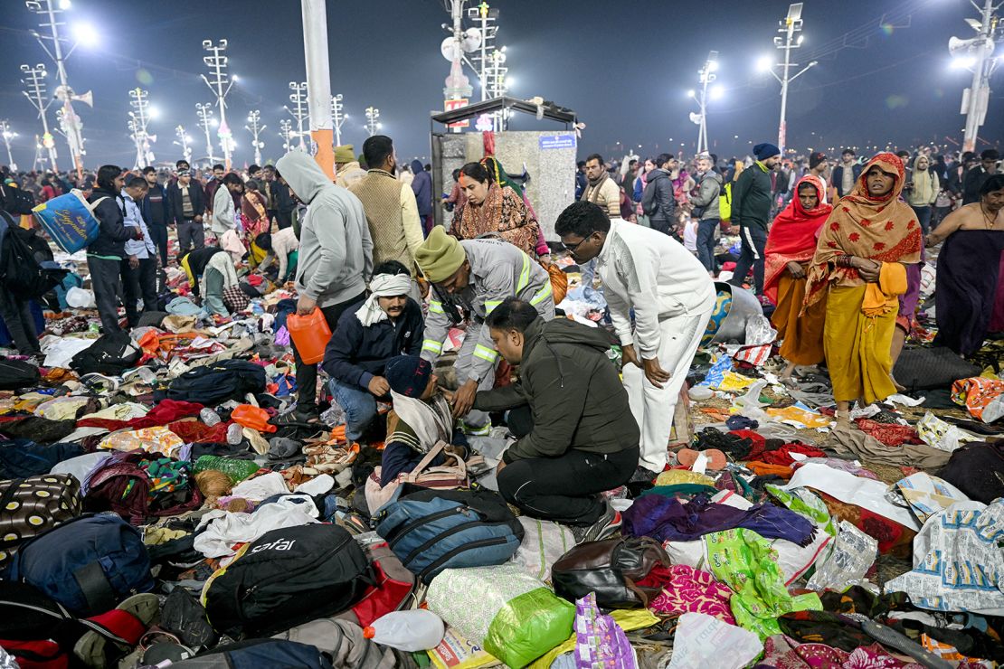 Police assist a man at the site of a <a href="https://www.cnn.com/2025/01/28/india/crowd-crush-kumbh-mela-india-intl-latam-hnk/index.html">deadly crowd crush</a>, where pilgrims were killed in a rush to take a holy dip in Prayagraj, on Wednesday, January 29.” class=”image_expandable__dam-img image_expandable__dam-img–loading” onload=”this.classList.remove(‘image_expandable__dam-img–loading’)” onerror=”imageLoadError(this)” height=”1067″ width=”1600″ loading=”lazy”></picture>    </div>
<div class=