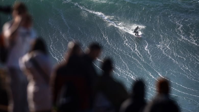 NAZARE, PORTUGAL - JANUARY 25: General view with people watching Laura Crane of Great Britian a wave during a surfing session at Praia do Norte on January 25, 2025 in Nazare, Portugal. (Photo by Stefan Matzke - sampics/Corbis via Getty Images)