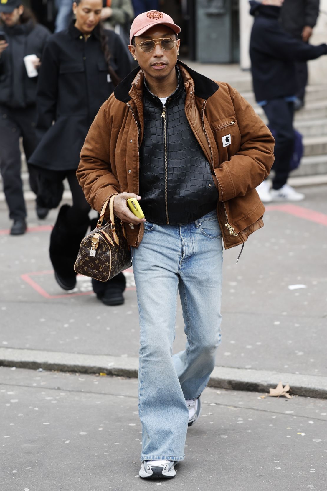 Pharrell Williams pictured in a pair of flared jeans at Paris Fashion Week last month.