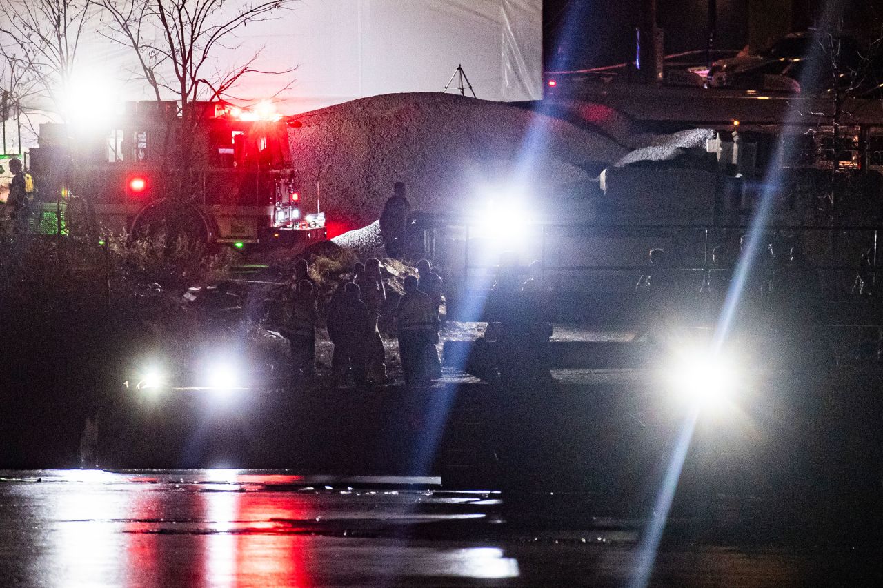 Emergency response units conduct search operations in the Potomac River on Wednesday.