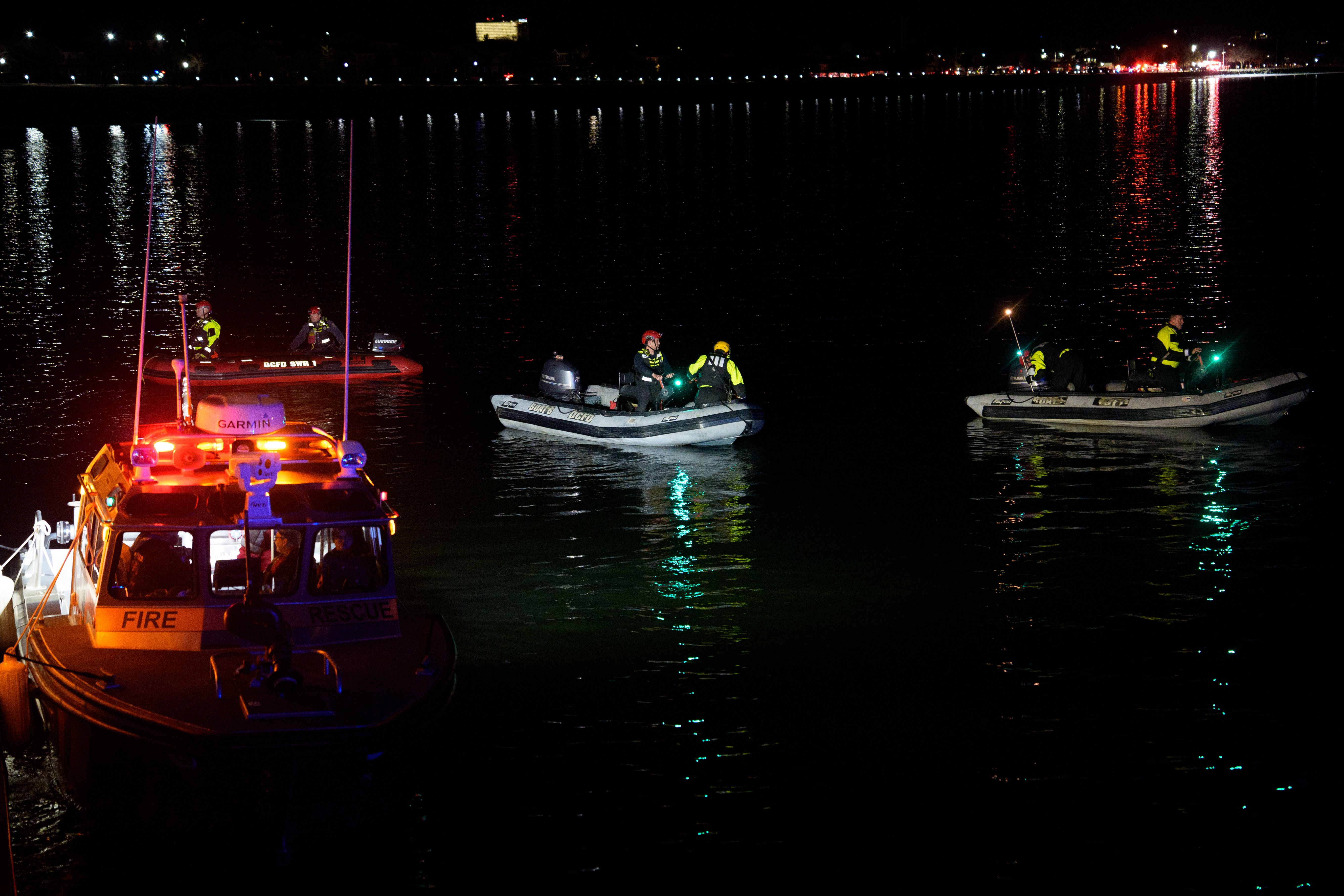 First responders make their way to the wreckage in the Potomac River early on Thursday.