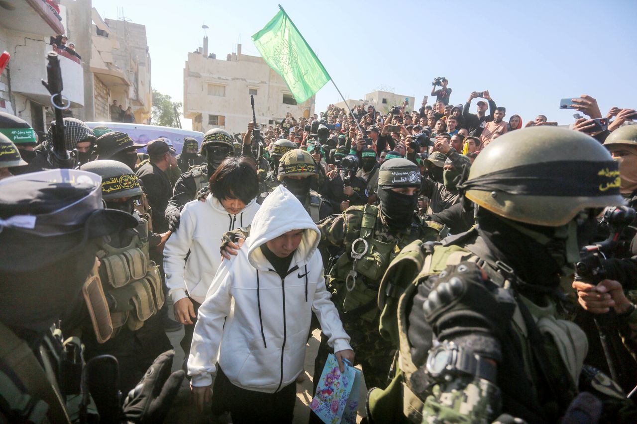 Five Thai hostages are seen arriving ahead of the handover to the members of the International Committee of the Red Cross (ICRC) by Hamas in Khan Younis, Gaza on Thursday.