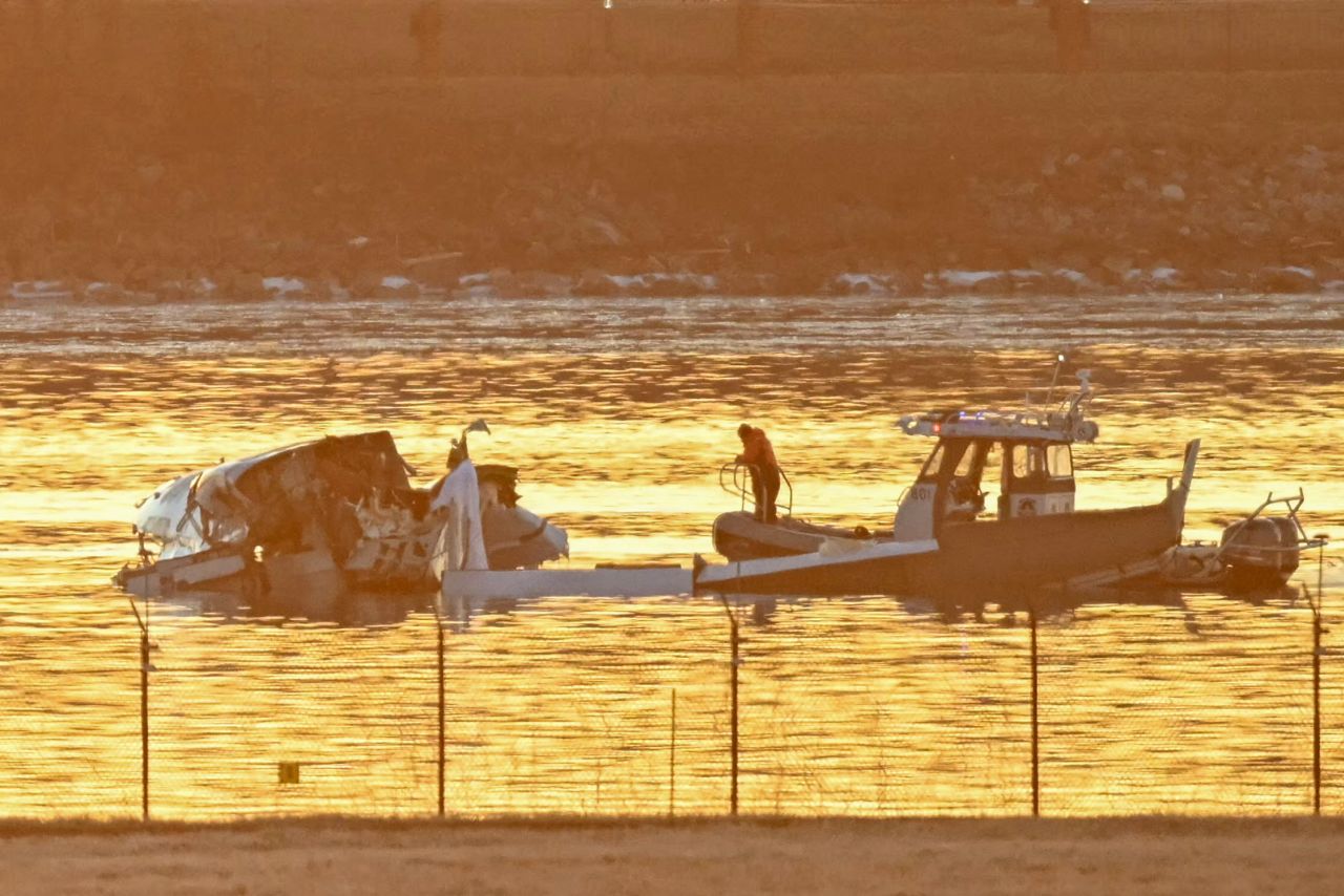 Rescue workers search the Potomac River on Thursday after a plane crashed into the river near Washington, DC.