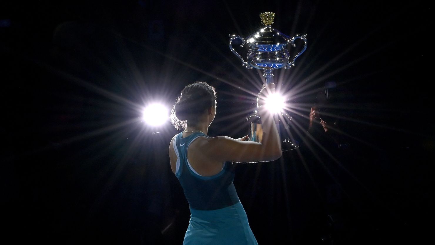 Madison Keys of the United States lifts the Daphne Akhurst Memorial Cup after the Women's Singles Trophy Presentation following the Women's Singles Final against Aryna Sabalenka during day 14 of the 2025 Australian Open at Melbourne Park on January 25, 2025 in Melbourne, Australia.