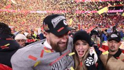 KANSAS CITY, MISSOURI - JANUARY 26: Taylor Swift celebrates with Travis Kelce #87 of the Kansas City Chiefs after defeating the Buffalo Bills 32-29 in the AFC Championship Game at GEHA Field at Arrowhead Stadium on January 26, 2025 in Kansas City, Missouri.  (Photo by Jamie Squire/Getty Images)