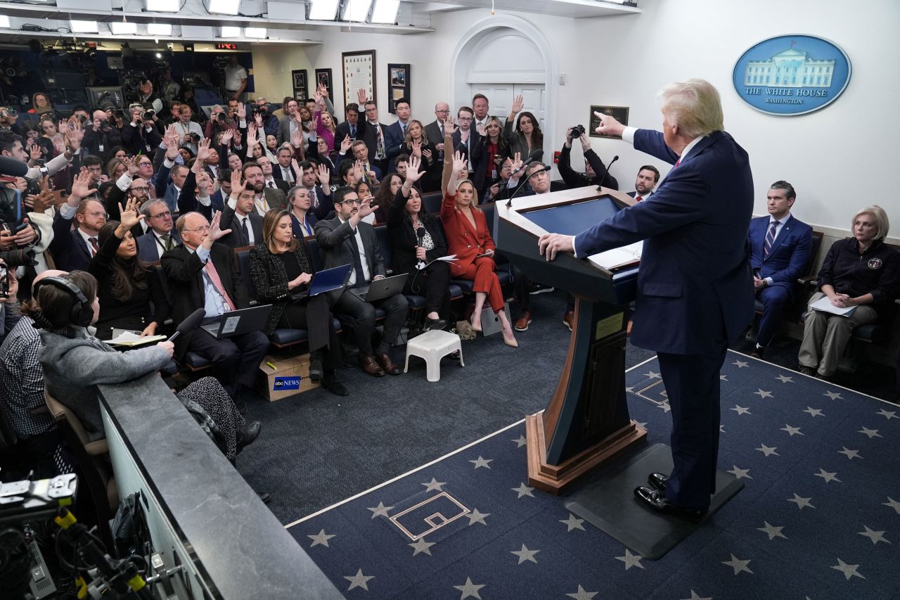 President Donald Trump takes questions from reporters during a briefing in the White House