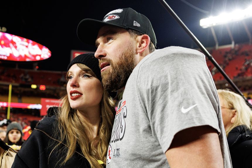 Tight end Travis Kelce #87 of the Kansas City Chiefs celebrates with Taylor Swift on the field after the AFC Championship game against the Buffalo Bills, at GEHA Field at Arrowhead Stadium on January 26, 2025 in Kansas City, Missouri.