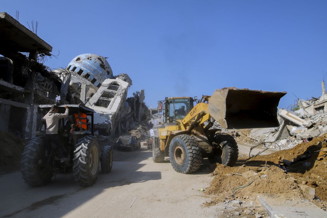 Bulldozers work to remove rubble in Beit Lahia as displaced Palestinians begin returning on January 29.