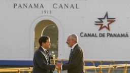 TOPSHOT - U.S. Secretary of State Marco Rubio (L) shakes hands with Panama Canal Authority  Ricaurte Vasquez during a tour at the Miraflores locks of the Panama Canal in Panama City on February 2, 2025. Rubio arrived on the eve on his debut trip abroad as US secretary of state, as he looks for how to follow up on President Donald Trump's extraordinary threat to seize the Panama Canal. (Photo by Mark Schiefelbein / POOL / AFP) (Photo by MARK SCHIEFELBEIN/POOL/AFP via Getty Images)          