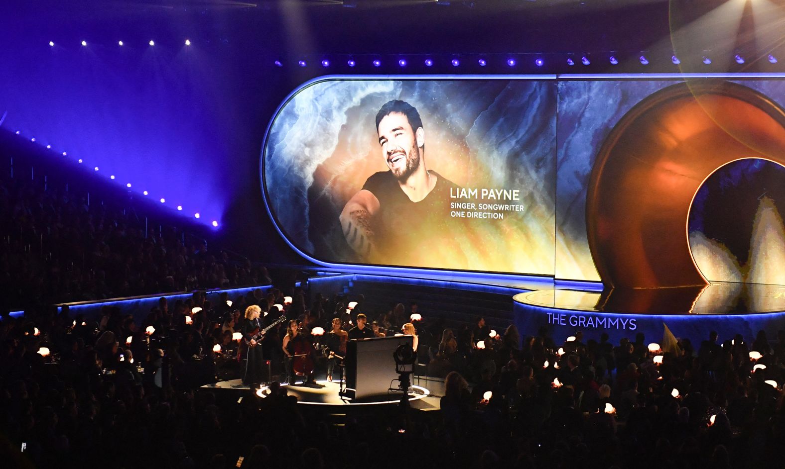 Former One Direction member Liam Payne is seen on screen at the start of the <a href="index.php?page=&url=https%3A%2F%2Fwww.cnn.com%2Fentertainment%2Flive-news%2Fthe-grammys-award-show-02-2-25%23cm6ohh6ll002j3b6mf5u9uugs">In Memoriam segment</a>. Payne died last year at the age of 31.