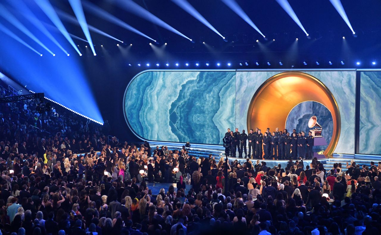 Los Angeles Fire Department firefighters appear on stage during the Grammy Awards.