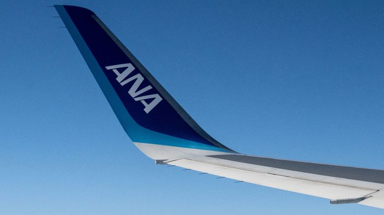 The wing of an an All Nippon Airways (ANA) aircraft is seen during a flight above Japan's Shizuoka prefecture on December 9, 2024.