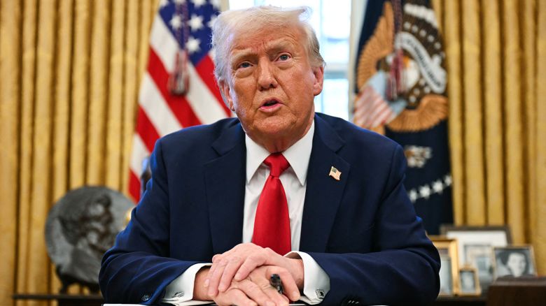 US President Donald Trump speaks to the press as he signs an executive order to create a US sovereign wealth fund, in the Oval Office of the White House on February 3, 2025, in Washington, DC.