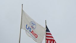 A USAID and American flag fly before Congressional Democrats hold news conference outside of United States Agency for International Development (USAID) headquarters in Washington, DC, on February 3, 2025. US Secretary of State Marco Rubio said Monday he had been put in charge of the US aid agency, saying he would stop its "insubordination" to President Donald Trump's agenda. After Trump's billionaire friend and advisor Elon Musk vowed to destroy the US Agency for International Development (USAID), whose website went dark over the weekend, Rubio confirmed he and the State Department had assumed control of the autonomous body. (Photo by Mandel NGAN / AFP) (Photo by MANDEL NGAN/AFP via Getty Images)          