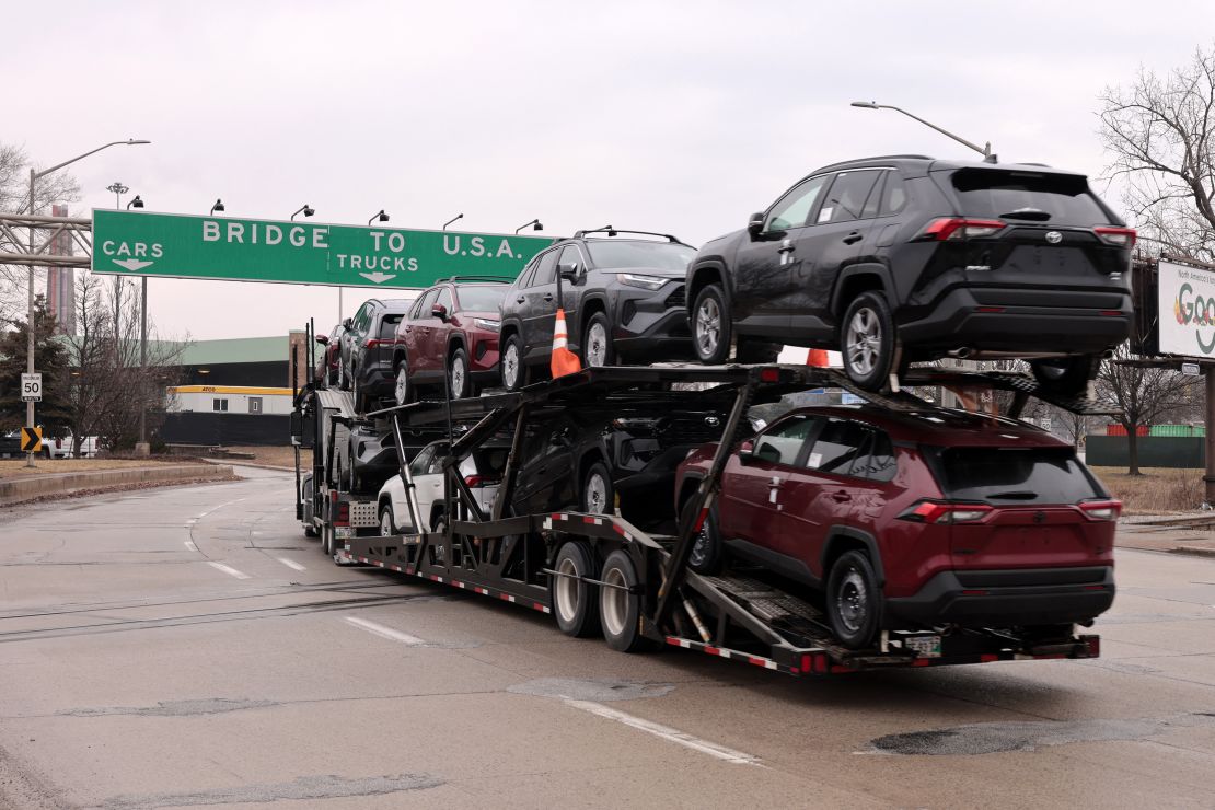 A car hauler carries Toyota RAV4 vehicles as it prepares to cross the Ambassador Bridge in Windsor, Ontario to go to Detroit, Michigan earlier this month.