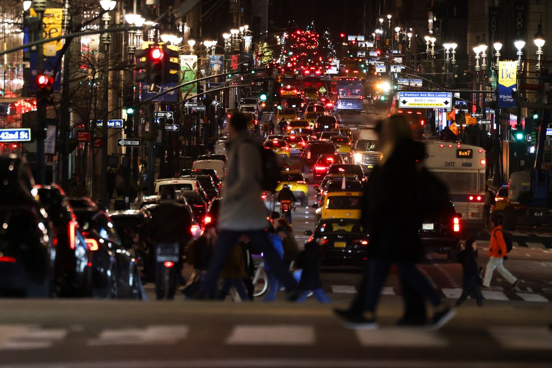 Cars and pedestrians move along Madison Avenue this month.