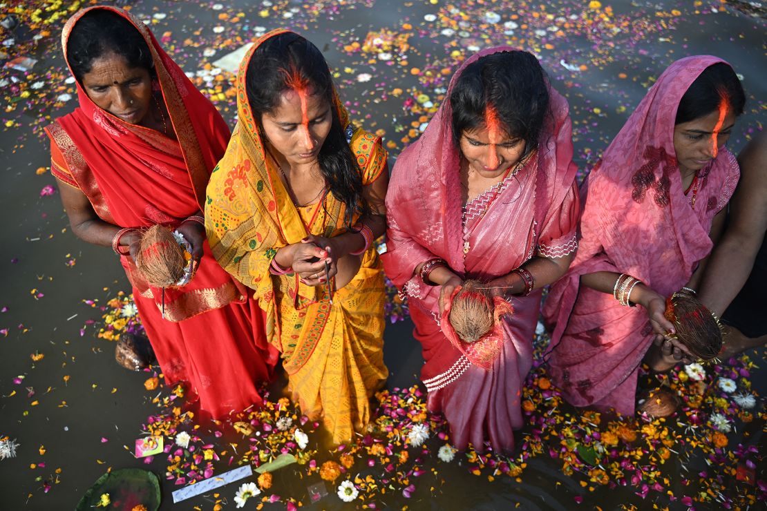 Pilgrims offer prayers while standing in the waters of the Triveni Sangam during the Maha Kumbh Mela festival in Prayagraj on Tuesday, February 4.