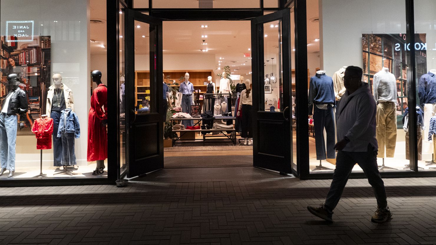 A shopper walks by a J. Crew store at the Westfield UTC shopping center on January 31, 2025 in San Diego.