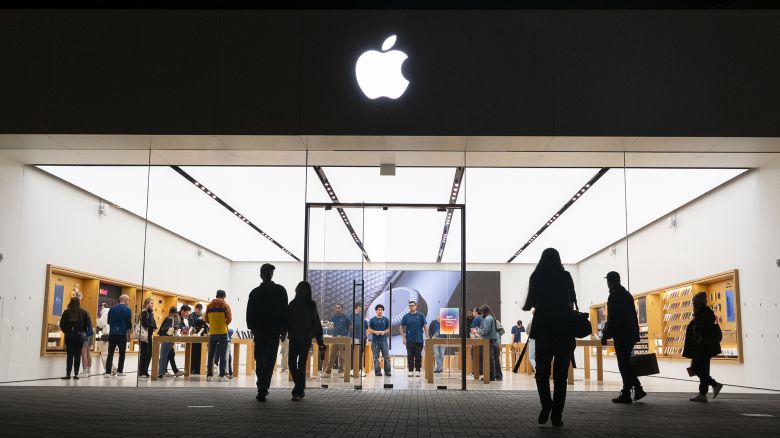 People walk by an Apple store at the Westfield UTC shopping center on January 31, 2025 in San Diego, California.