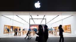 People walk by an Apple store at the Westfield UTC shopping center on January 31, 2025 in San Diego, California.