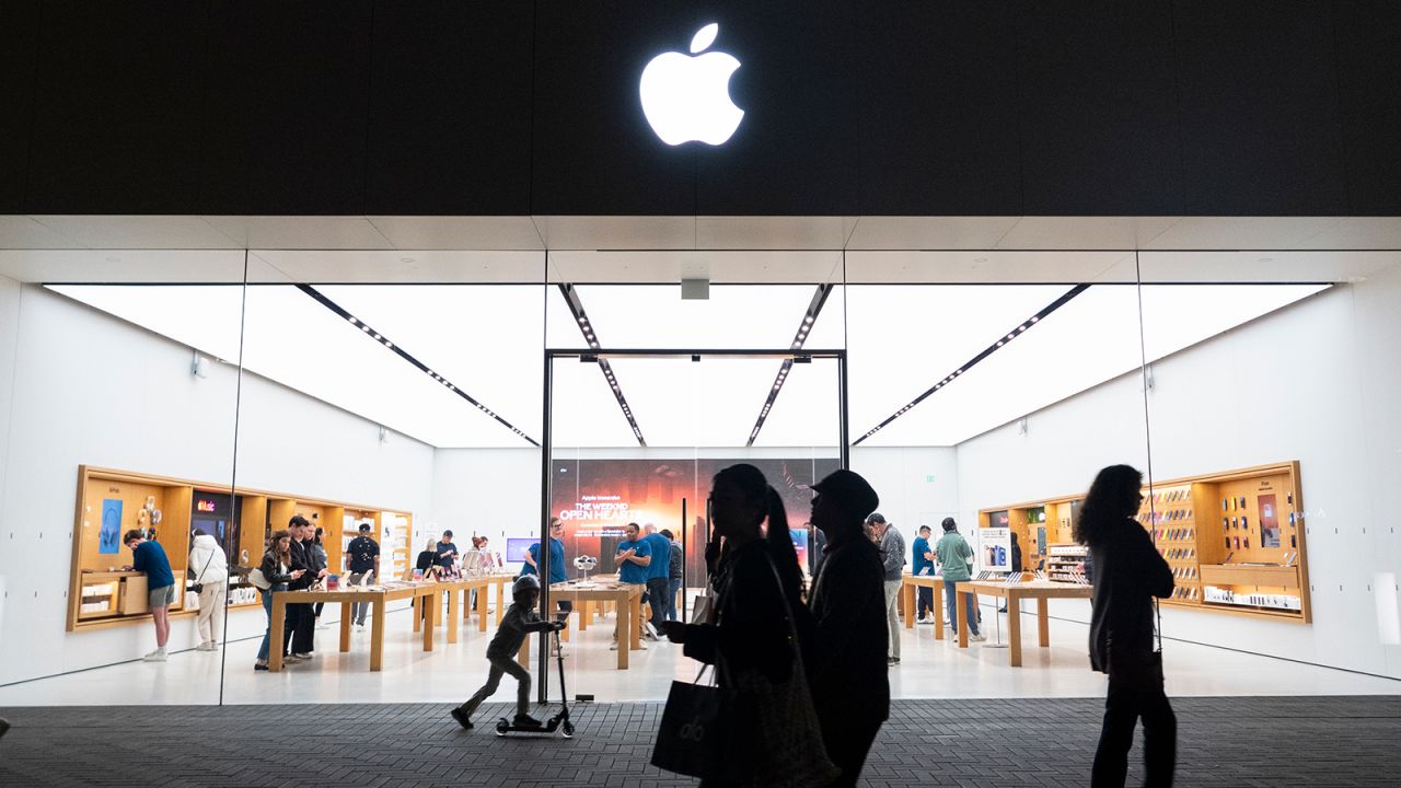 People walk by an Apple store at the Westfield UTC shopping center on January 31, 2025 in San Diego, California.