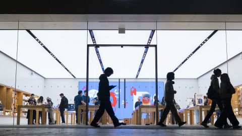 People walk by an Apple store at the Westfield UTC shopping center on January 31, 2025 in San Diego, California.