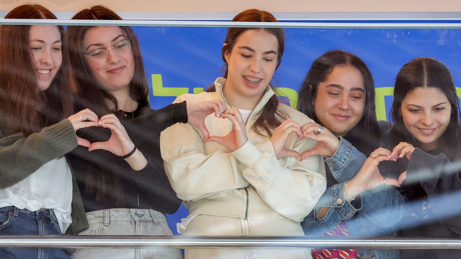 Released Israeli hostages (from left) Naama Levy, Karina Ariev, Agam Berger, Liri Albag and Daniella Gilboa watch a muscial performance in their honor as they prepare to leave the hospital and go home. Their mothers know their recovery will still take time.