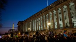 Demonstrators protest Elon Musk's access to the Treasury Department's payment systems, outside the US Treasury Department on February 4, 2025.