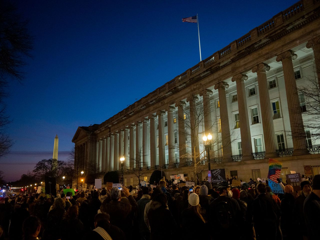 Demonstrators protest Elon Musk's access to the Treasury Department's payment systems outside the US Treasury Department on February 4.