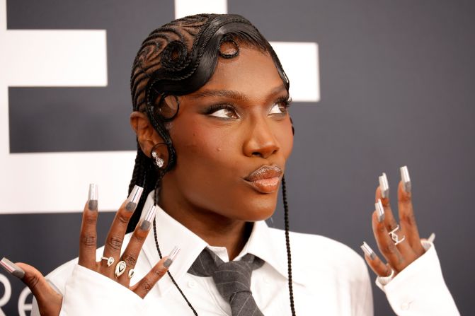 Doechii shows off her nails as she arrives to the Crypto.com Arena on Sunday. <a  target="_top" href="/newspapers?url=https://www.cnn.com/2025/02/02/style/red-carpet-looks-grammys">See the best fashion from the red carpet</a>.