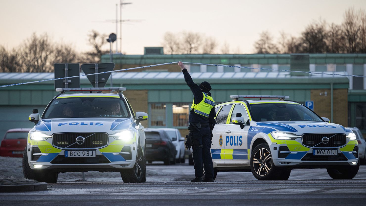 Police officers stand guard outside the Campus Risbergska school in Örebro, Sweden, on Thursday, two days after the mass shooting there.